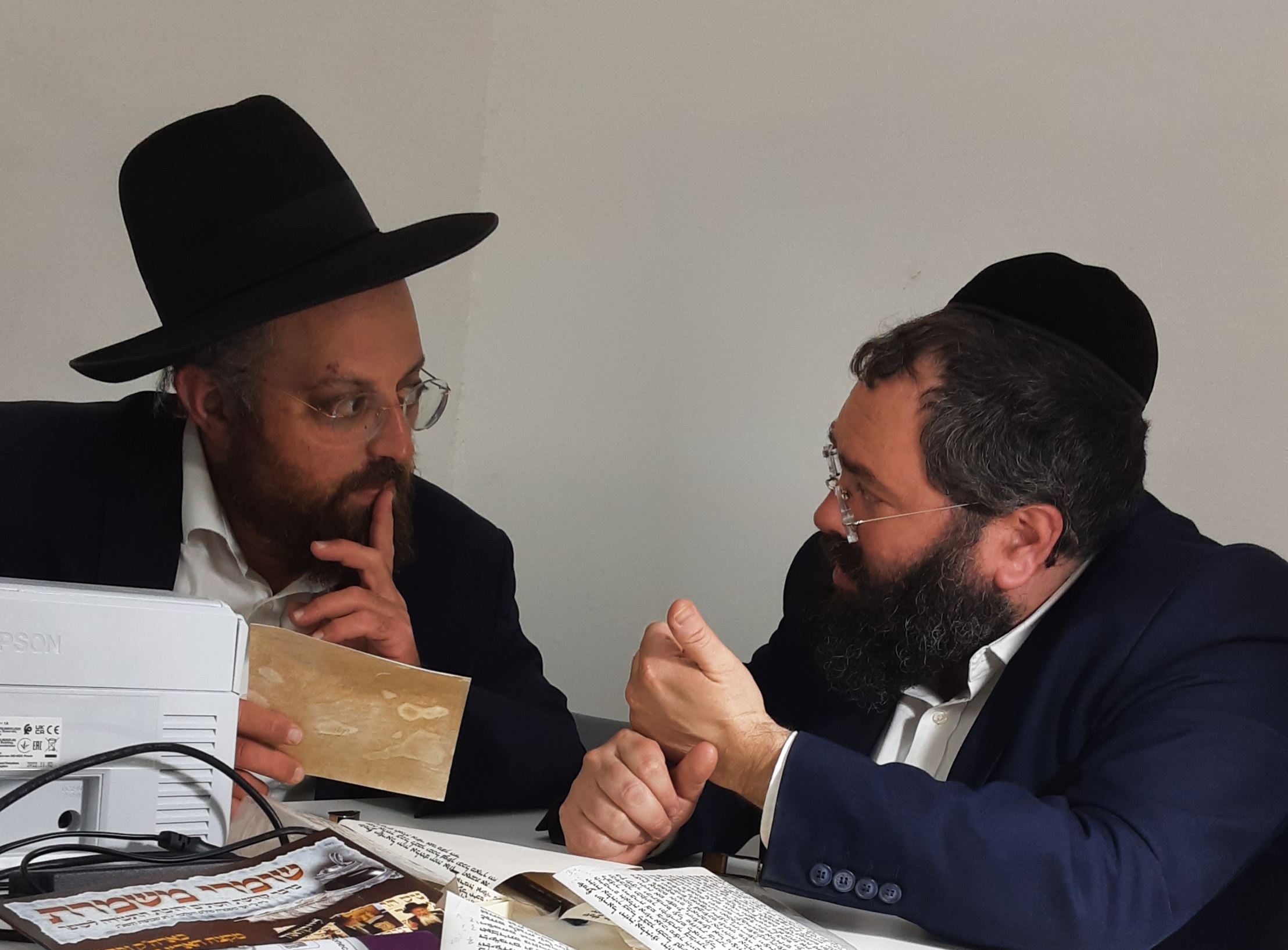 Rabbonim reviewing Sta"m with the VMS computer check